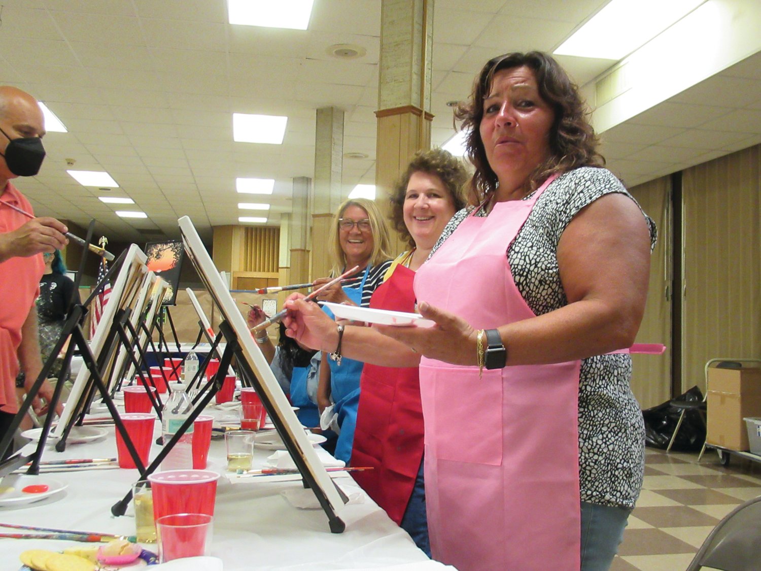 PICTURE PERFECT: The artists-for-an-evening above — Sandra Lentini, Barbara DeCubellis and Monica DiDonato — are just a few of the many people who enjoyed the Pannese Society’s first-ever Paint and Vino event.